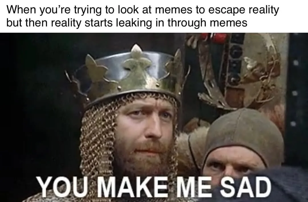 A still from a medieval-themed TV show shows a bearded man wearing a crown and chainmail, looking somberly at the viewer…