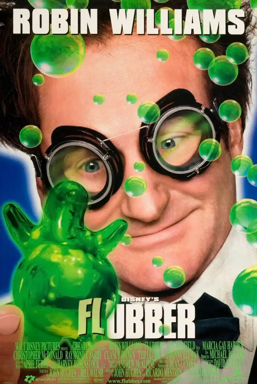 This is a movie poster for Disney's 'Flubber' starring Robin Williams. He wears large goggles and holds a green, gelatinous…