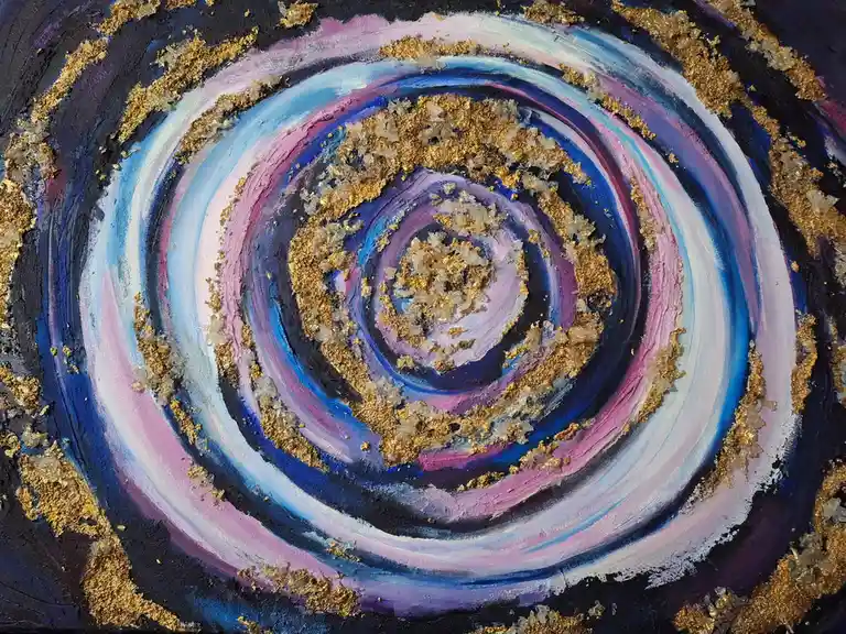 A close-up of a textured, abstract painting featuring concentric swirling bands of blue, purple, and white paint, accented…