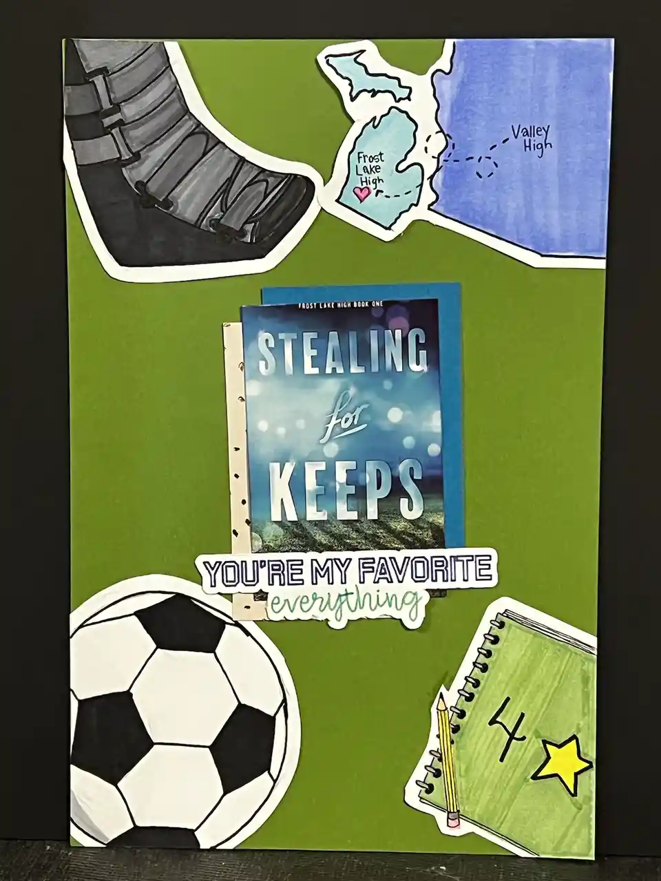 A handmade green poster collage featuring a soccer ball, a soccer cleat, a map showing 'Frost Lake High' and 'Valley High'…