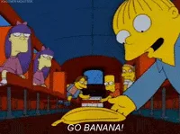 A still frame from The Simpsons shows a character in a blue shirt leaning over a large yellow banana, with the text 'GO…