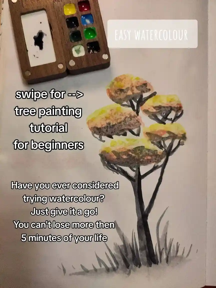 A watercolor painting of a tree with messy, blotchy yellow and brown foliage and black branches, next to a wooden paint…