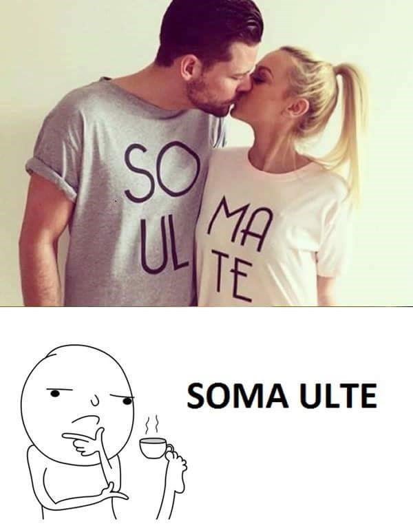 A couple kisses while wearing t-shirts that together spell 'SOULMATE' — the man's shirt says 'SOUL' and the woman's says…