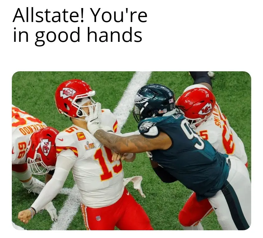 A football player in a white and red uniform is being tackled by an opponent in a dark teal uniform, with another player in…