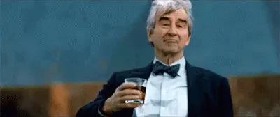 A sequence of six frames shows an older man in a tuxedo holding a glass of whiskey, slowly raising it from chest level to…