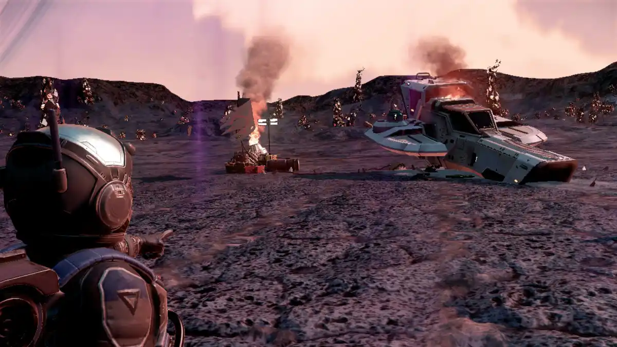 A character in a futuristic space helmet points toward two wrecked, burning spacecraft on a barren, rocky alien planet under…