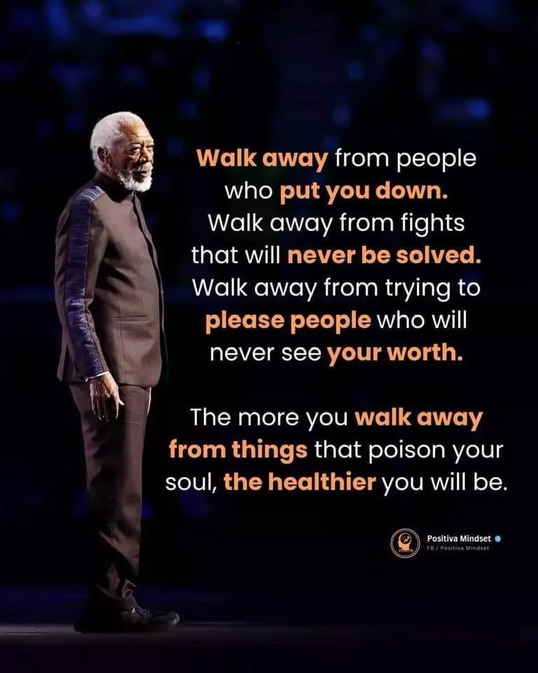 An image of actor Morgan Freeman standing on a stage in a dark suit, looking off to the side with a calm expression…