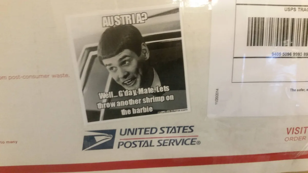 A black-and-white photo of a man with a surprised expression is overlaid with text reading 'AUSTRIA?' and 'Well... G'day…