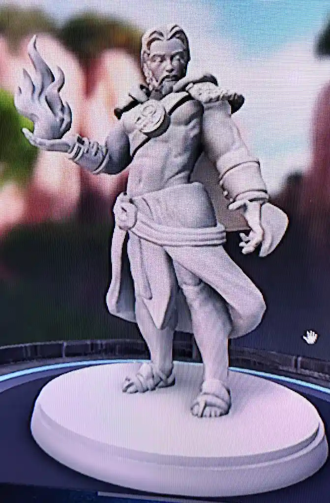 A grayscale 3D-printed fantasy miniature of a wizard with a flame in one hand and a staff in the other, standing on a…