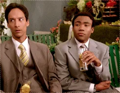 six sequential frames from a scene showing two men in suits sitting on a green bench; the man on the left looks increasingly…