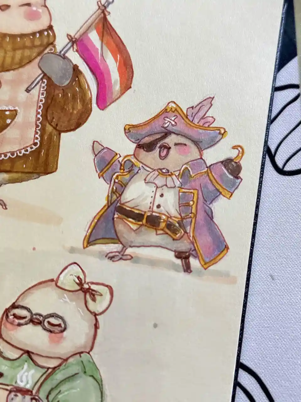 A watercolor illustration shows three cute, anthropomorphic animal characters. The central figure is a chubby, pinkish-brown…