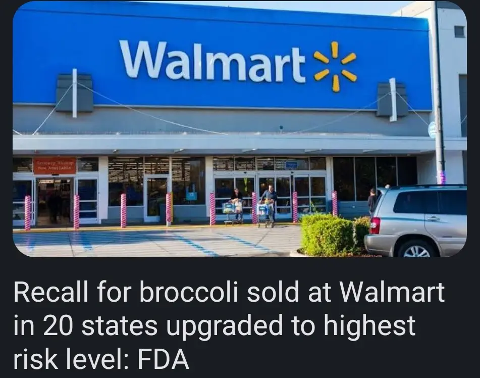 An exterior photo of a Walmart store with its iconic blue sign and yellow spark logo. People are visible near the entrance…