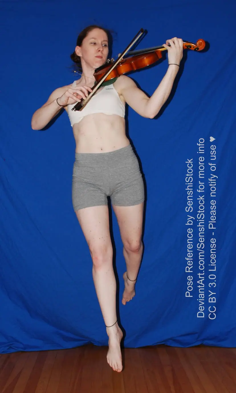 A woman in a white sports bra and grey shorts is captured mid-air, playing a violin against a solid blue backdrop. The image…