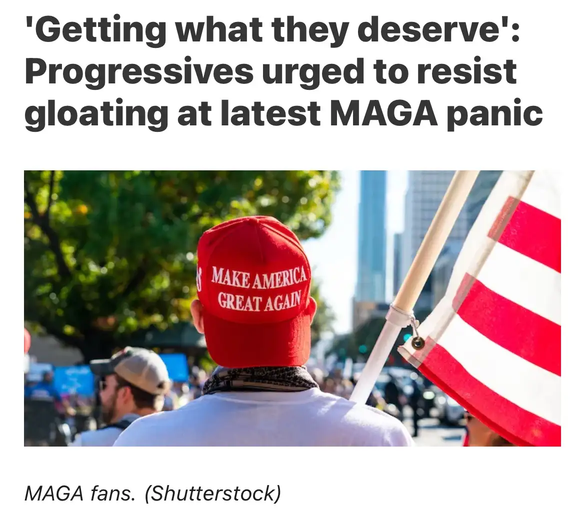 A person viewed from behind wears a red 'MAKE AMERICA GREAT AGAIN' cap and holds an American flag, standing in a crowd…