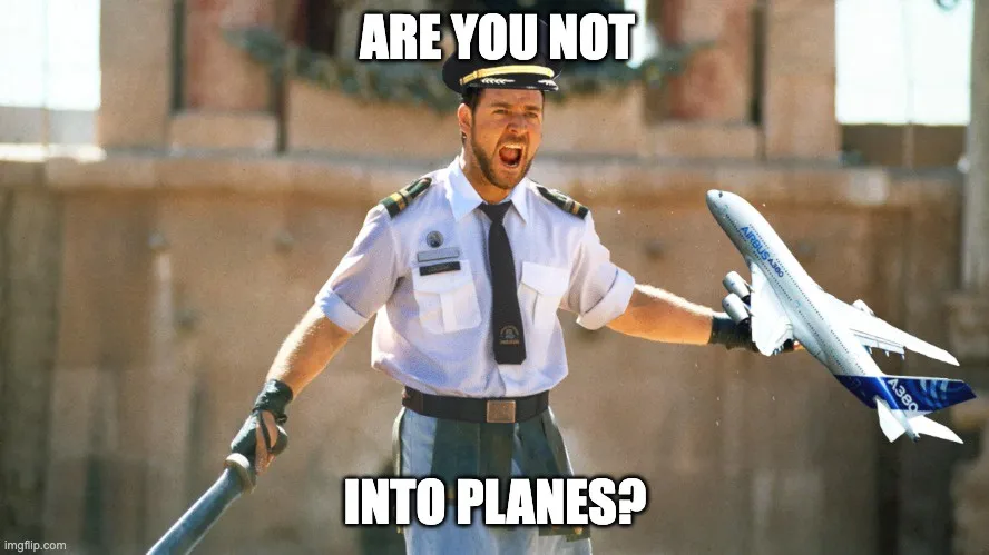 A man dressed in a pilot's uniform, holding a toy Airbus A380 airplane in one hand and a baton in the other, is yelling with…