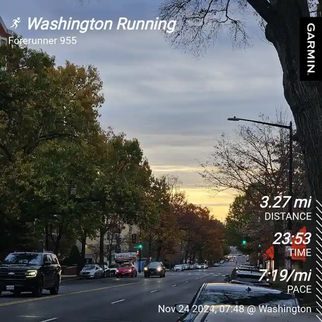 A screenshot from a Garmin Forerunner 955 GPS watch shows a running route in Washington during dawn, with trees lining a…