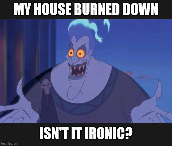 A still image of the animated character Hades from Disney's Hercules, with a wide, smug grin and glowing orange eyes…