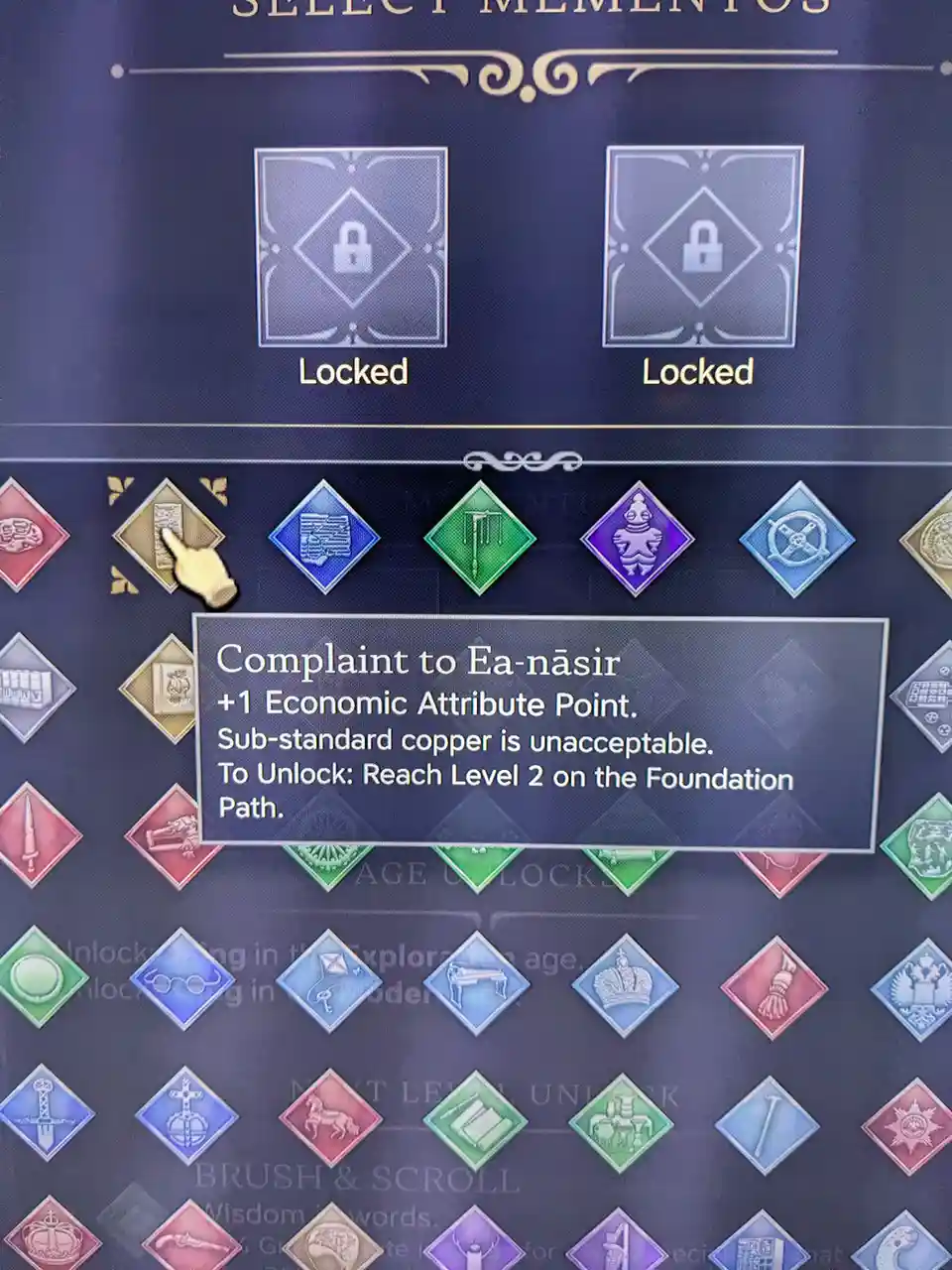 A screenshot from a game's 'Select Mementos' menu shows a golden diamond icon with a hand cursor hovering over it…