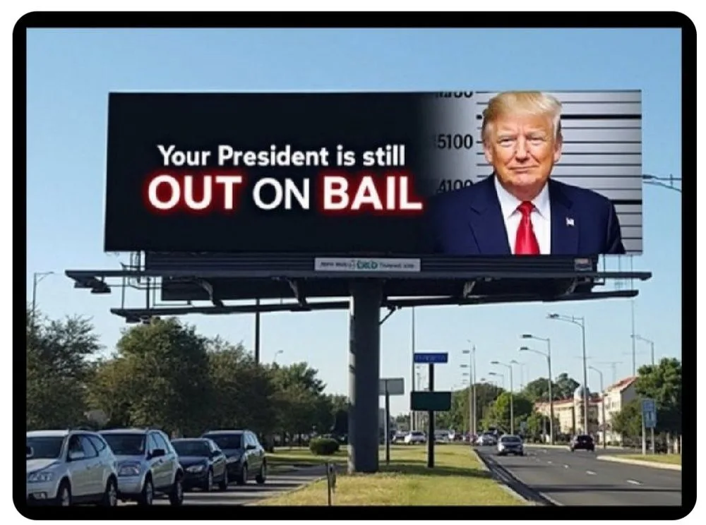 A large outdoor billboard displays a mugshot-style photo of Donald Trump on the right side, with the text 'Your President is…