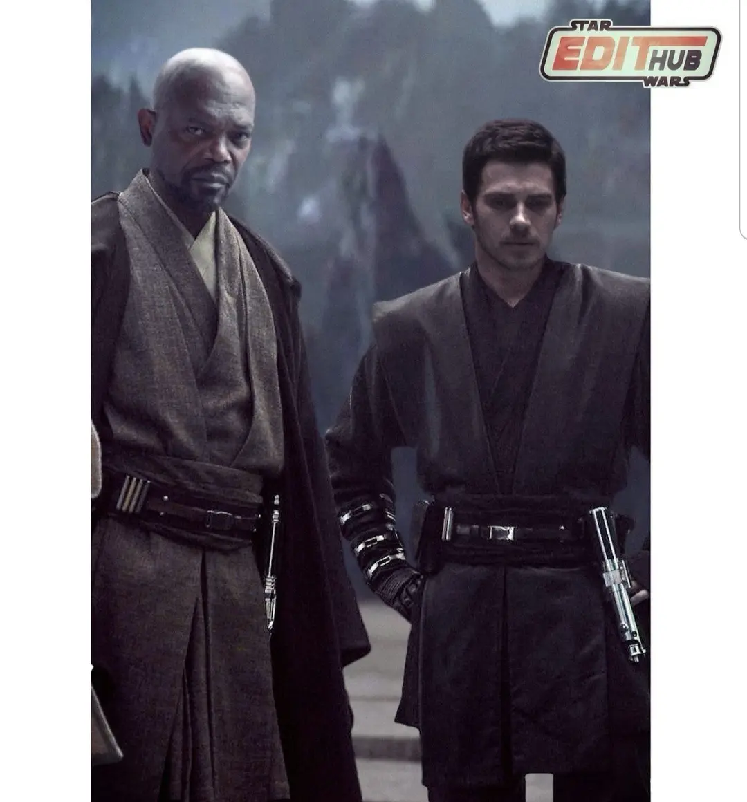 Two men in Star Wars Jedi robes stand side by side, one with a bald head and the other with dark hair, both holding…