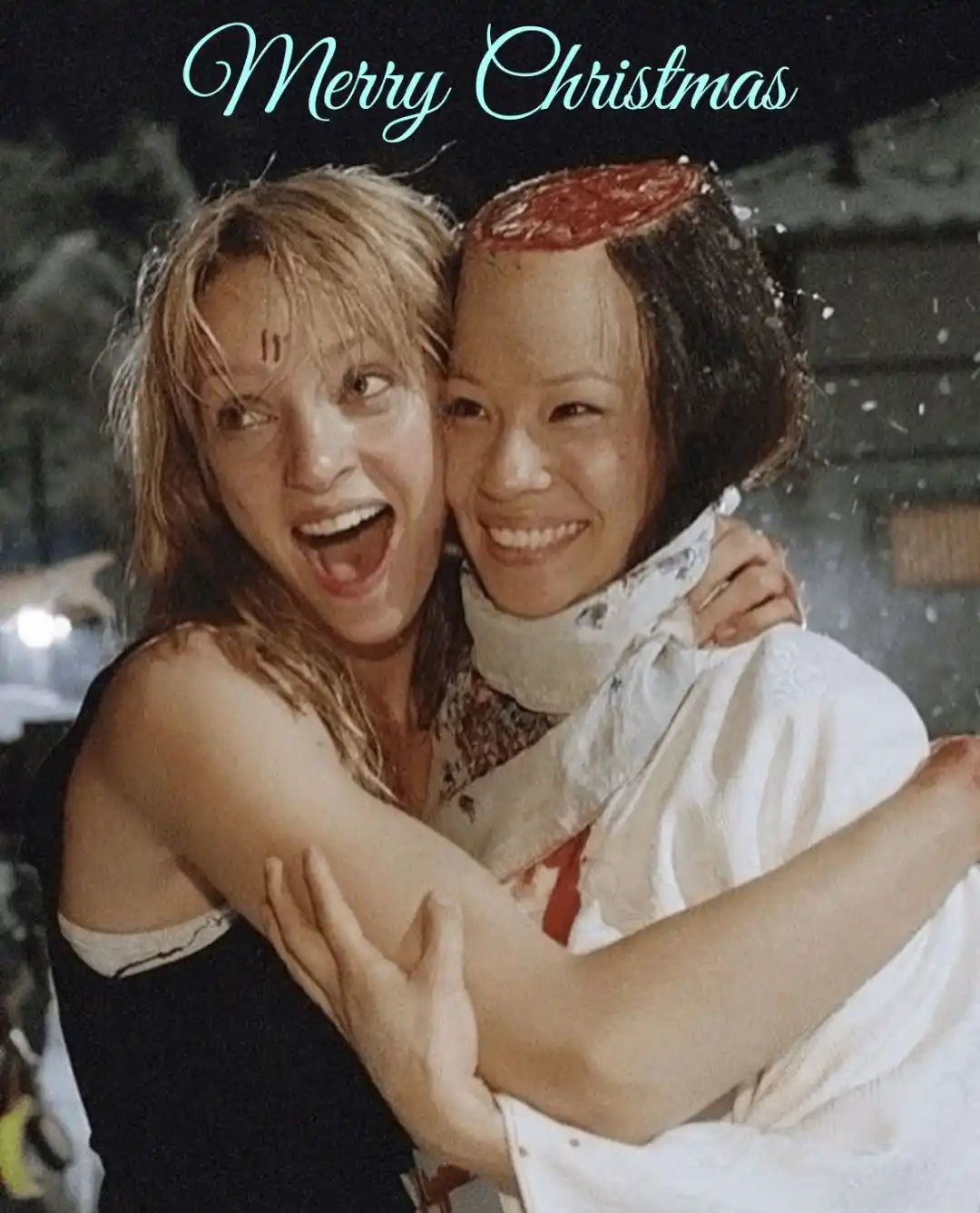Two women are hugging in a snowy scene, one with a bloody wound on her head and the other with a bloody mark on her…