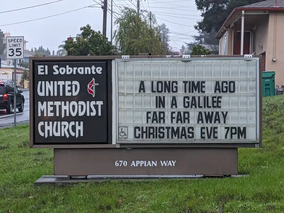 A church sign for El Sobrante United Methodist Church displays a marquee with the text 'A LONG TIME AGO IN A GALILEE FAR FAR…