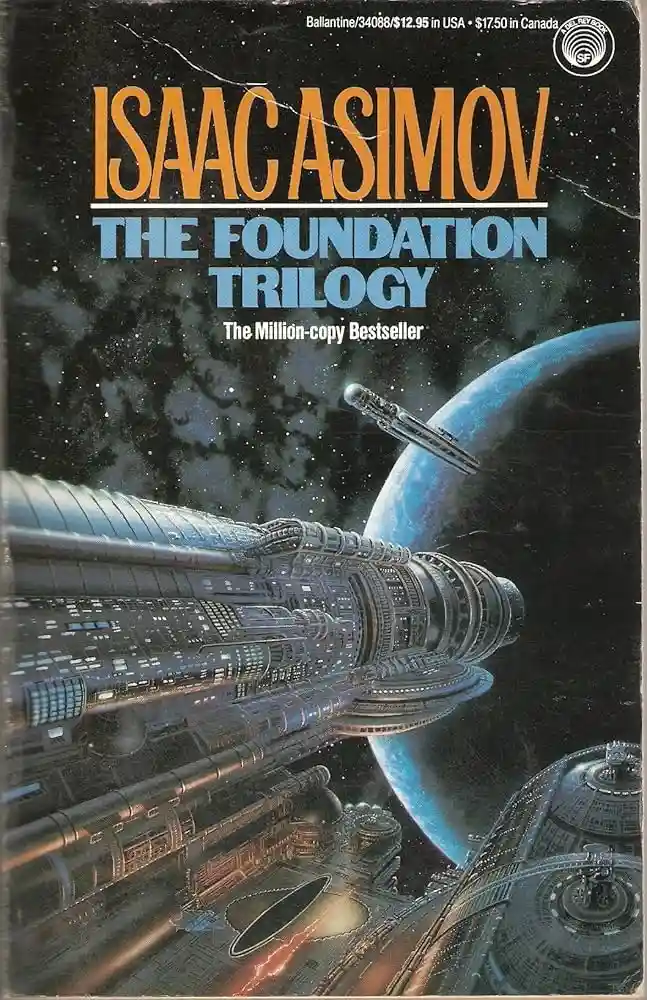 The image shows the cover of Isaac Asimov's 'The Foundation Trilogy' book, featuring a large, intricate spaceship in the…