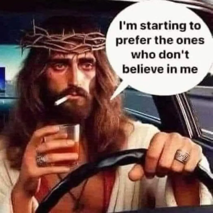 A man depicted as Jesus Christ, wearing a crown of thorns, is shown driving a car while holding a glass of amber liquid in…