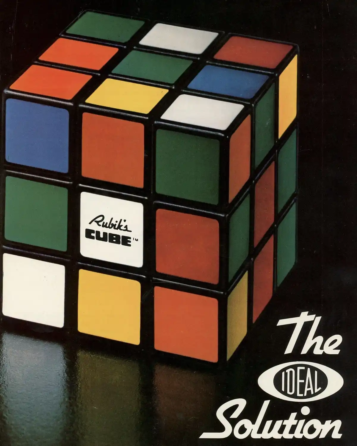 A vintage advertisement image shows a solved Rubik's Cube with its classic colorful squares against a dark background. The…