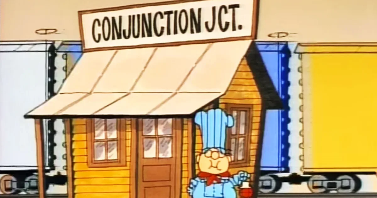 A cartoon chef in a blue uniform and tall hat stands outside a small yellow wooden building labeled 'CONJUNCTION JCT.' with…