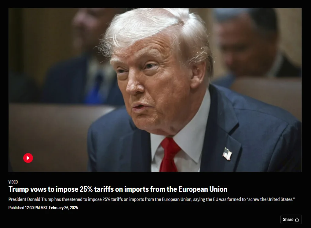 A still image of Donald Trump in a dark suit and red tie, looking serious while seated, with a blurred background of other…