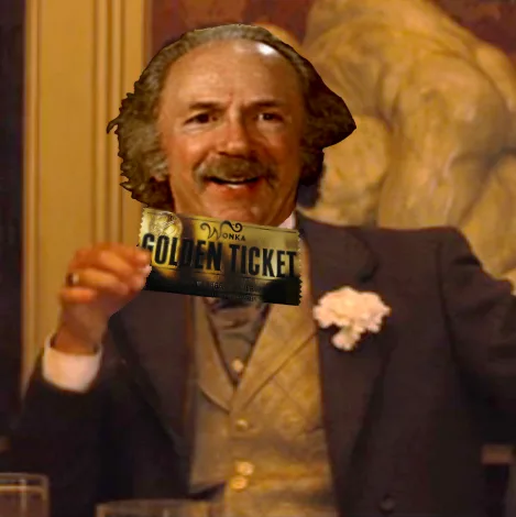 A man with a mustache and curly hair, dressed in a suit with a white flower boutonniere, holds up a golden ticket that reads…
