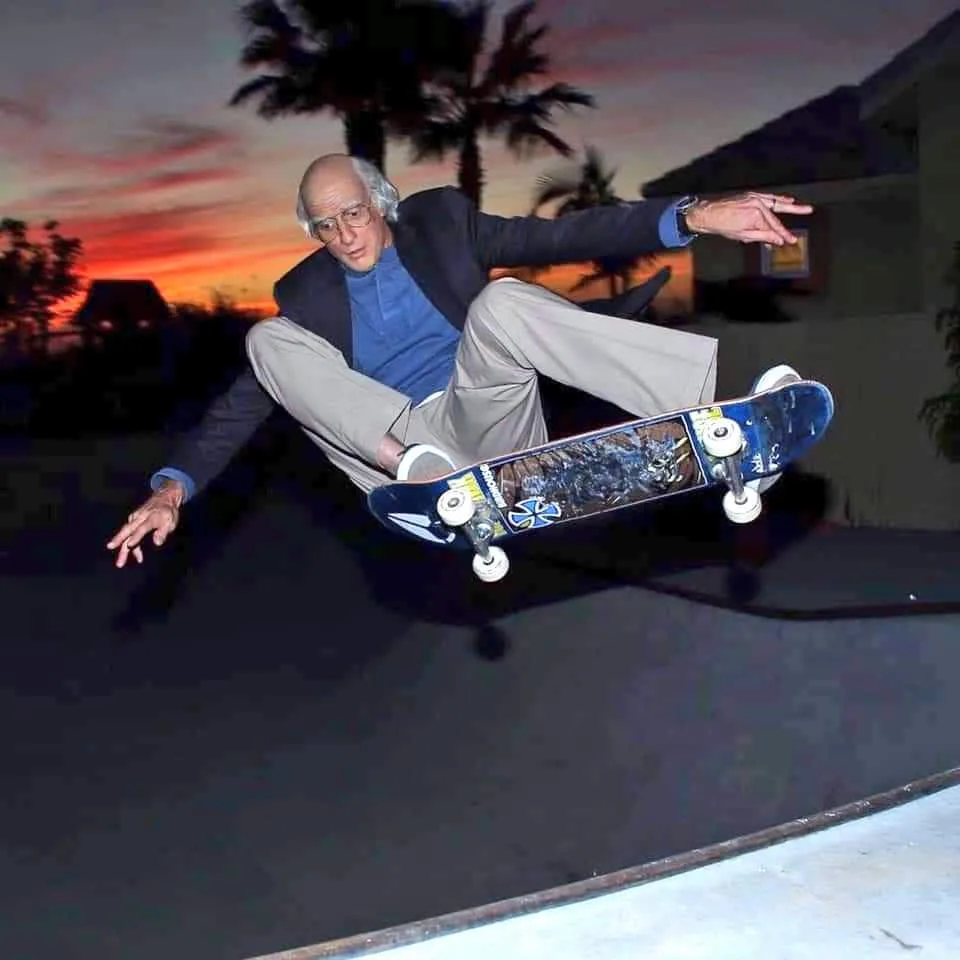a man in a suit and glasses, identified as senator bernie sanders, is captured mid-air performing a skateboard trick against…