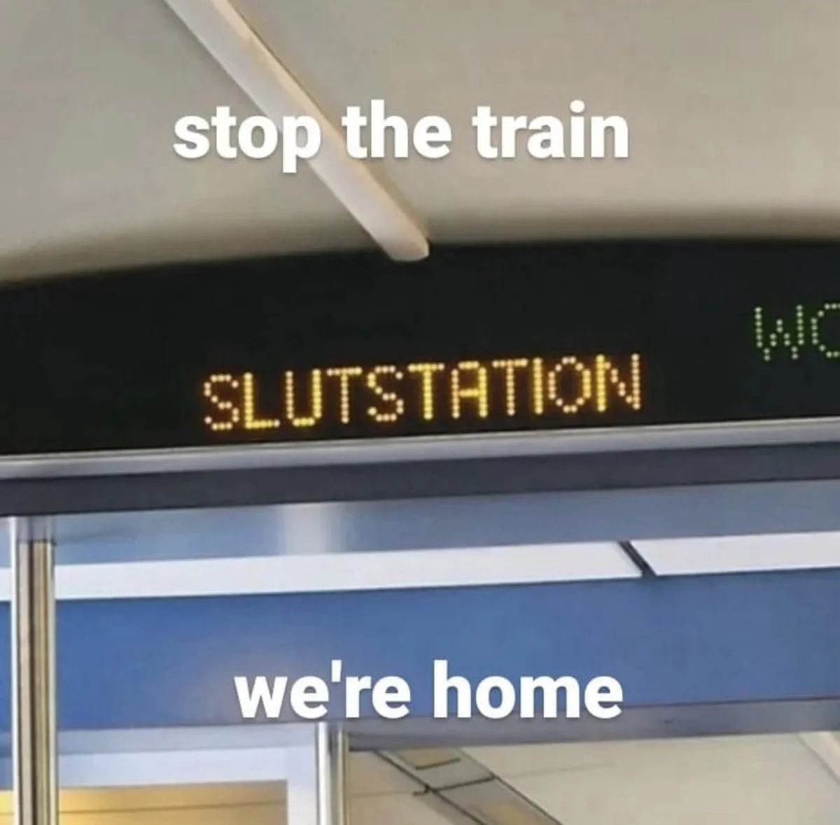 A close-up photo of a train station platform sign displaying the word 'SLUTSTATION' in yellow LED letters. White text…