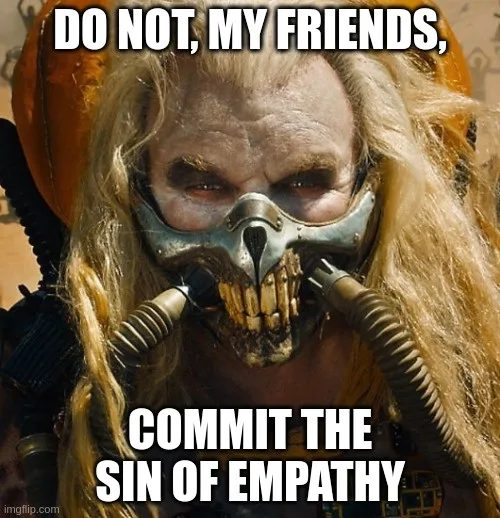 A close-up of a character with long blonde hair wearing a skull-like metallic mask with breathing tubes, looking intensely…