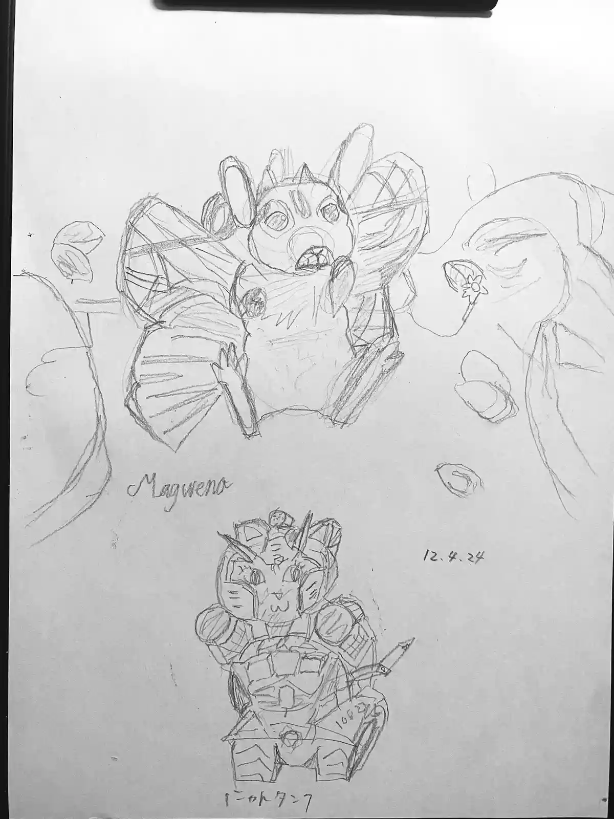A pencil sketch on paper shows two cartoonish characters: a bat-like creature with large ears and wings labeled 'Magwena' at…