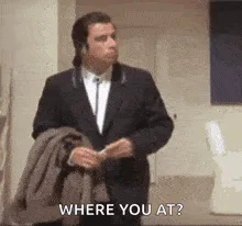 A six-panel image sequence shows a man in a dark suit holding a jacket, repeatedly asking 'WHERE YOU AT?' while gesturing…