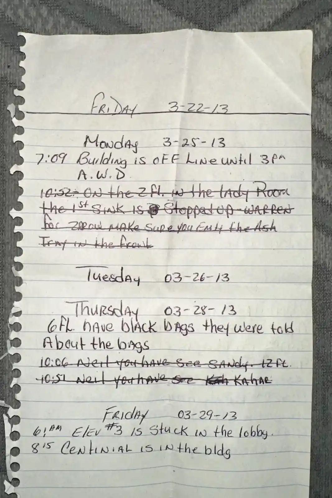 A handwritten note on lined paper dated March 2013 lists daily maintenance issues in a building, including a building…