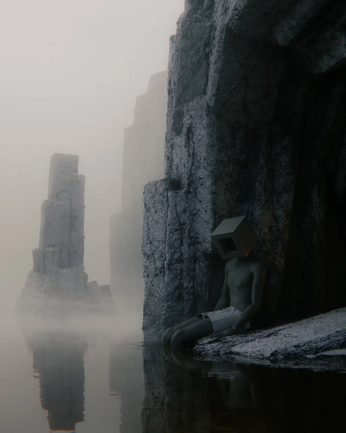 A person with a cube for a head sits by a misty body of water next to a large rock formation, wearing white shorts. The cube…
