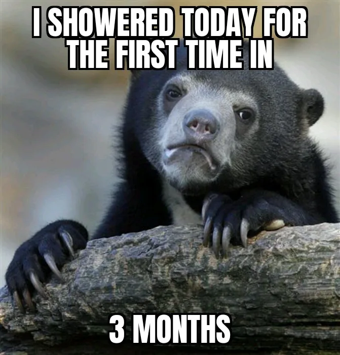 A close-up photo of a sad-looking spectacled bear resting its paws on a log, with white bold text overlaid at the top…