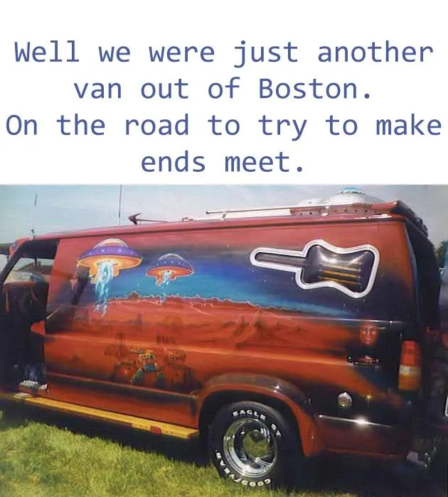 A red van with psychedelic artwork featuring UFOs, aliens, and a large guitar cutout is parked on grass. Blue text overlaid…