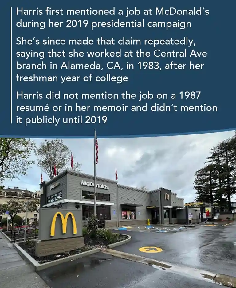 The image shows an exterior photo of a McDonald's restaurant on a wet, overcast day, with its iconic golden arches sign…