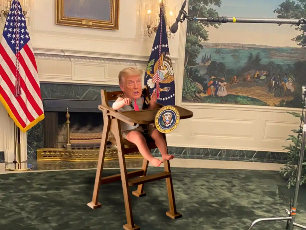 A digitally manipulated image shows a baby with Donald Trump's face sitting in a wooden high chair, wearing a pink tie and…