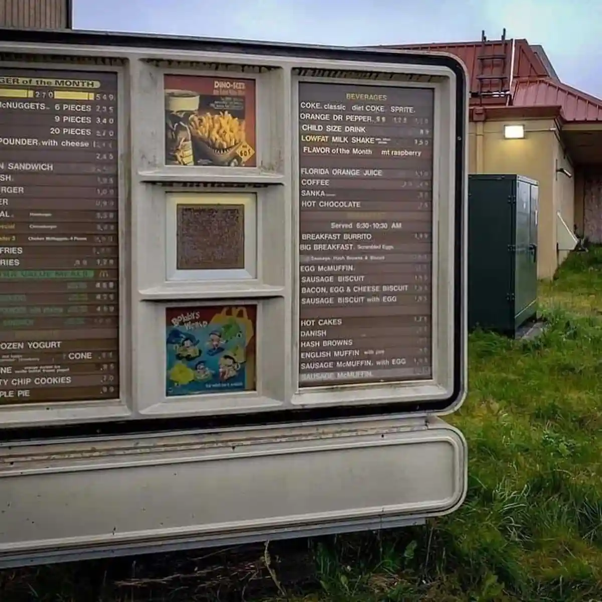 An outdoor McDonald's menu board shows a 'Dino-Size' fries ad with a price of 60¢, but the actual fries section below it is…
