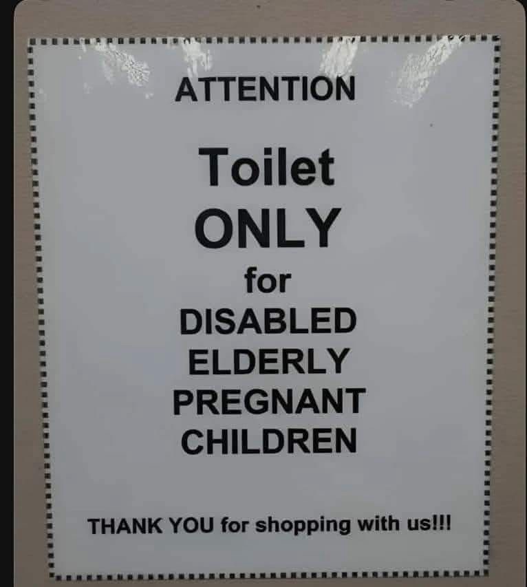 A white sign with black text and a dotted border reads 'ATTENTION Toilet ONLY for DISABLED ELDERLY PREGNANT CHILDREN' and…
