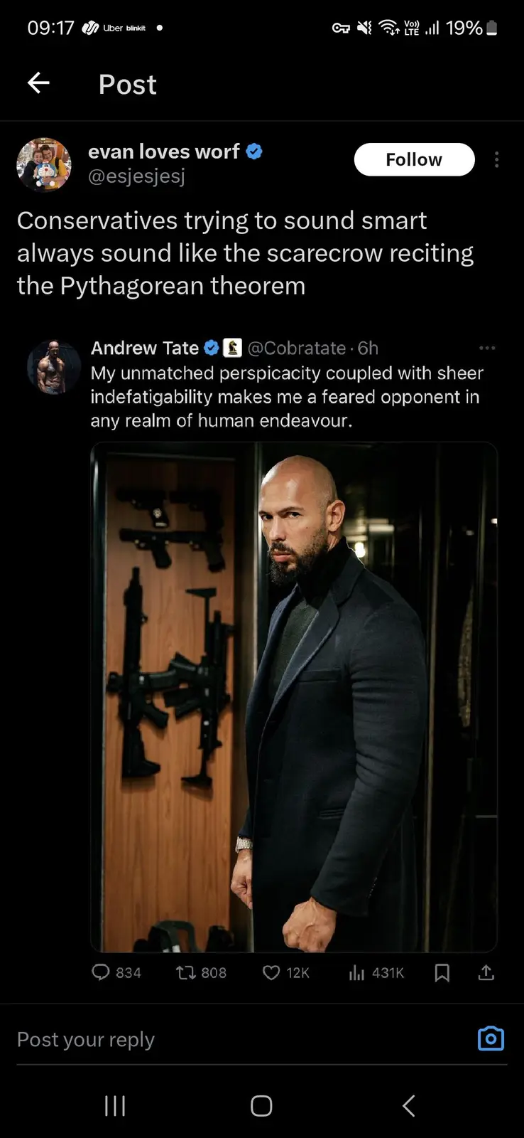 A screenshot of a Twitter post by 'evan loves worf' featuring a photo of Andrew Tate standing in front of a wall with…