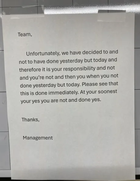 A printed memo taped to a wall, with a confusing and grammatically incorrect message from 'Management' to 'Team' about…