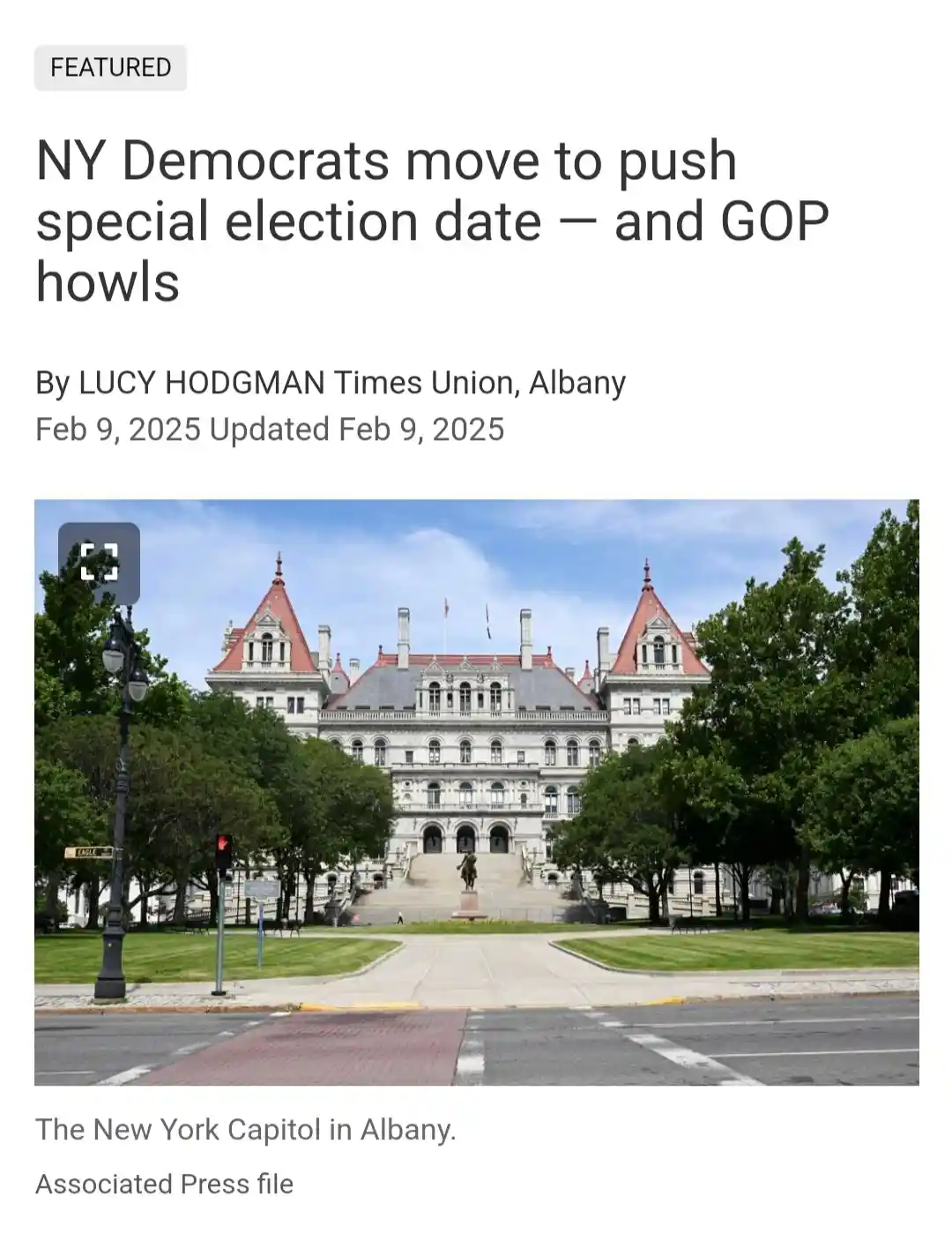 A screenshot of a news article header showing the New York Capitol building in Albany, with the headline 'NY Democrats move…