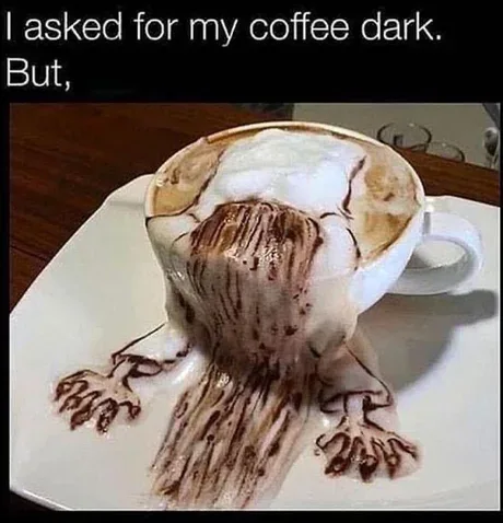 A white coffee cup sits on a white saucer, overflowing with coffee and foam that has been artistically dripped to resemble a…