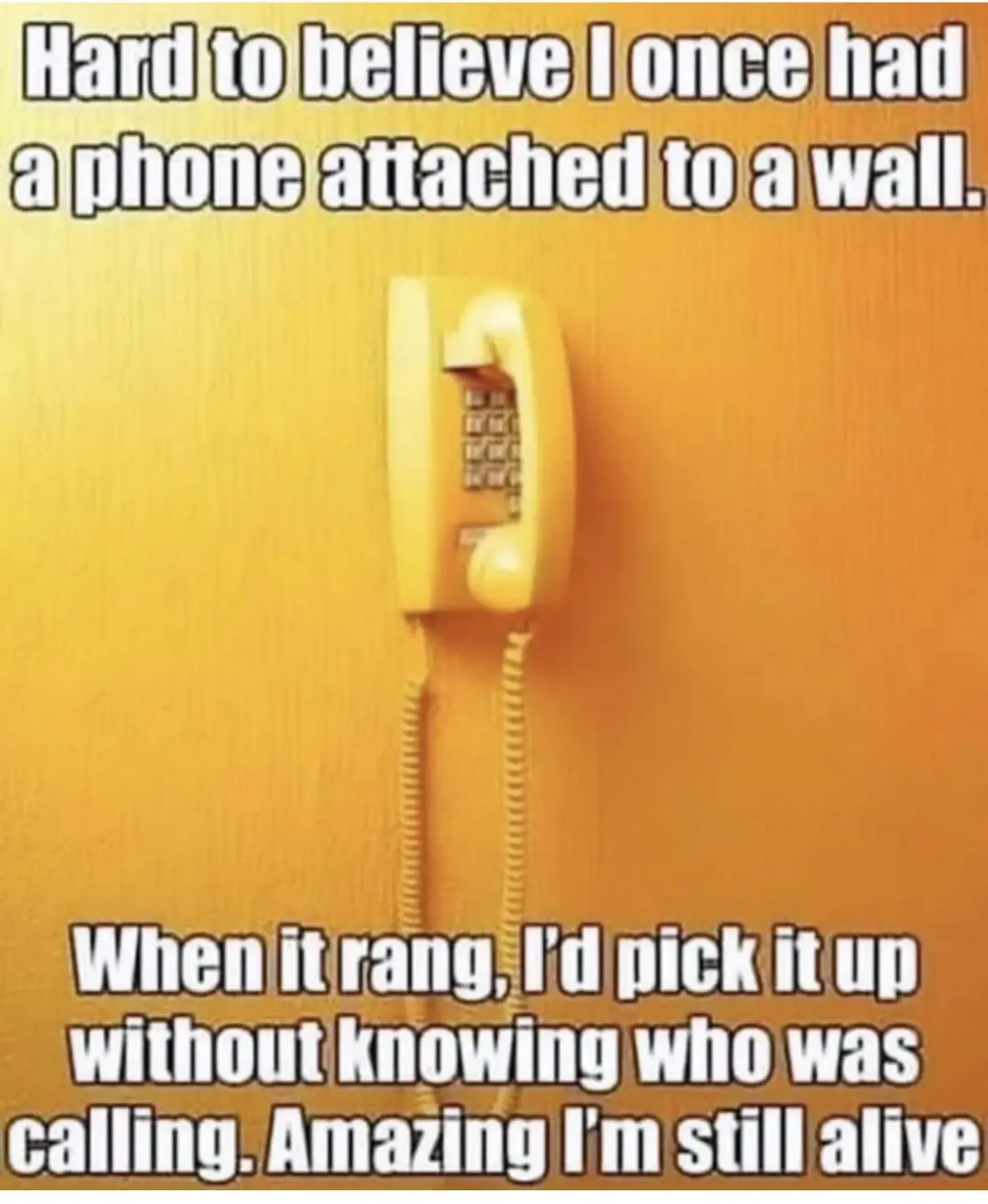 A yellow rotary wall-mounted telephone is shown against a textured orange wall. White text overlaid at the top reads 'Hard…